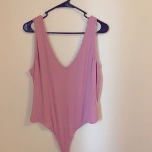 Pink lace trimmed body suit
